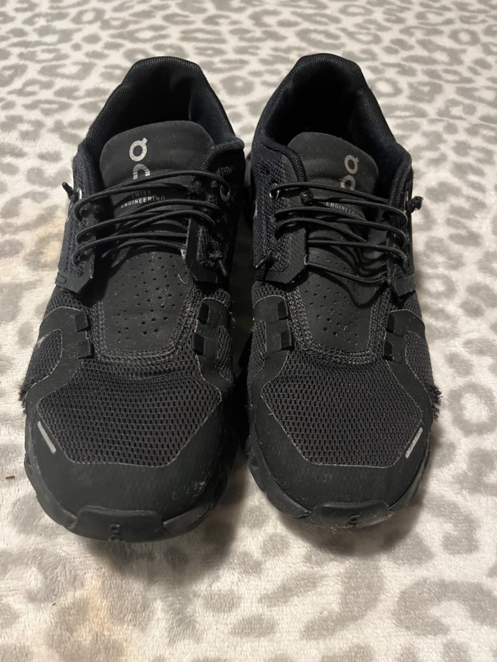 On Running woman’s Black Mesh Trail Sneakers